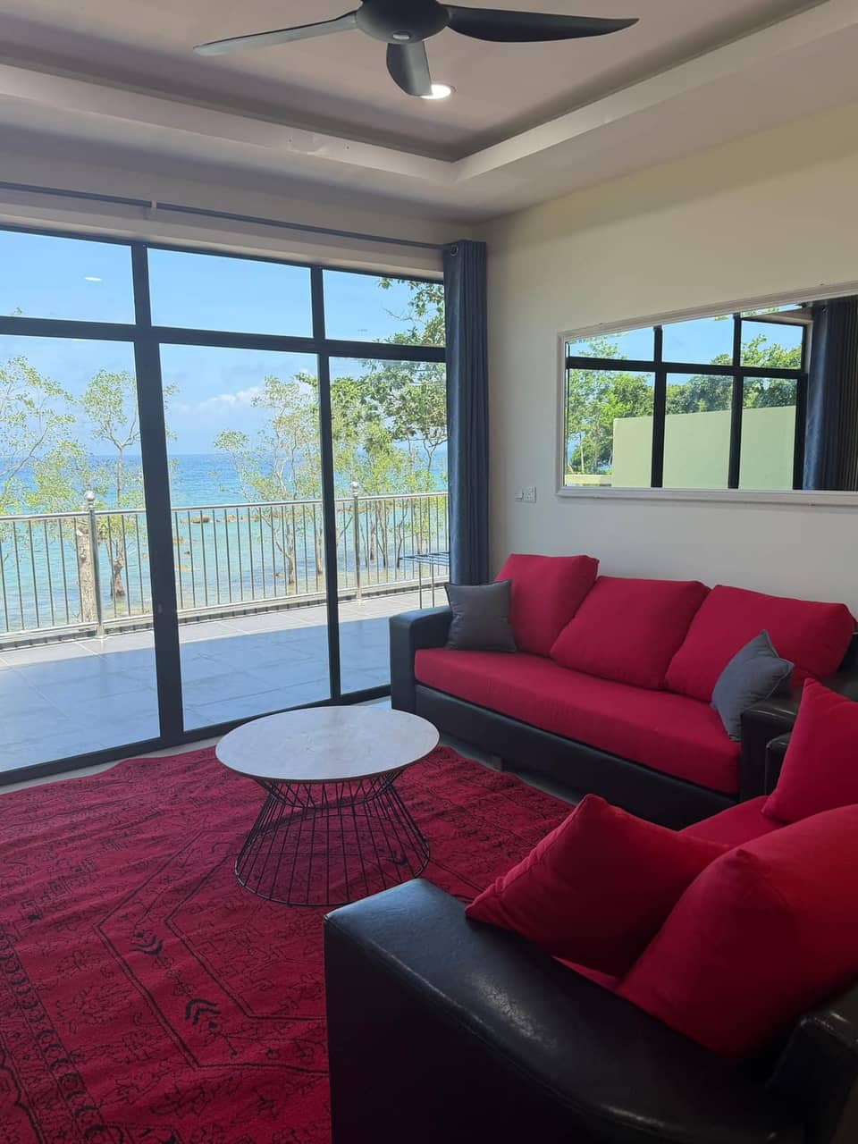 Open-plan living area with South China Sea views in the villa